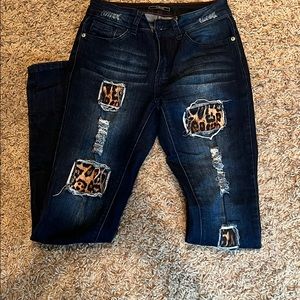 Denim and cheetah distressed skinny jeans
